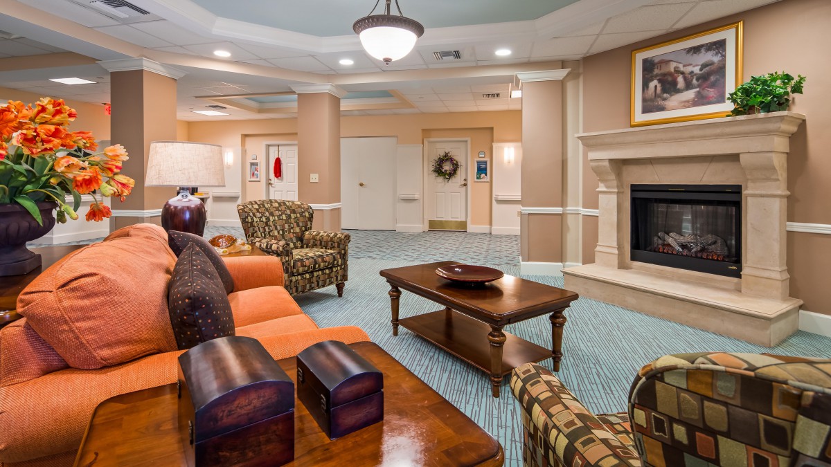 A cozy living room with comfortable seating and a fireplace.