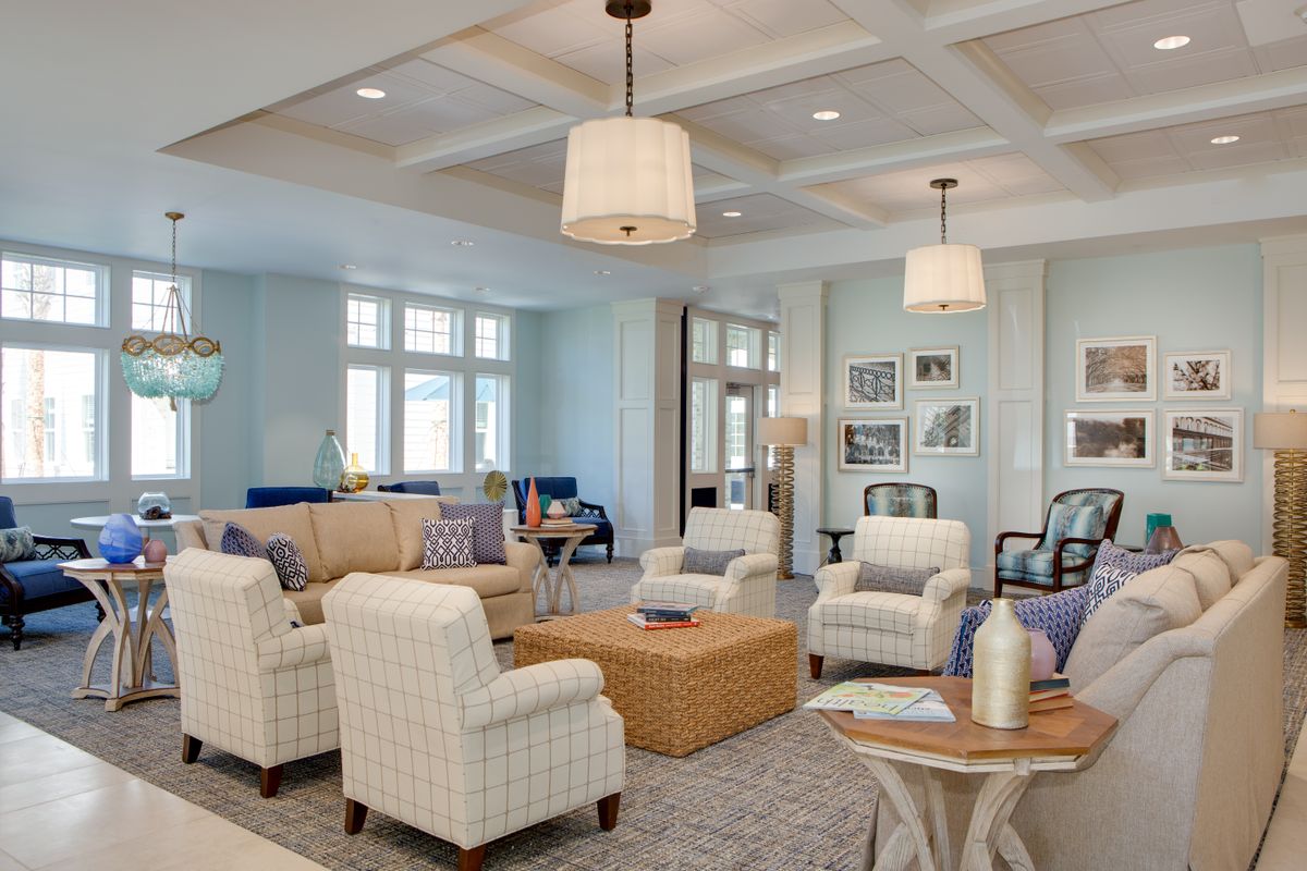 A modern living room with elegant furnishings and soft lighting.