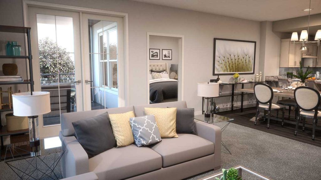 A modern living room featuring a comfortable sofa with colorful cushions and elegant decor.