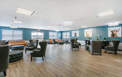 A modern lounge area featuring comfortable seating and a serene atmosphere.