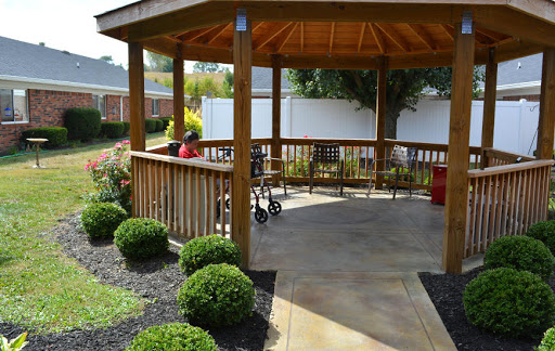 A serene gazebo nestled in a beautifully landscaped garden, perfect for relaxation.