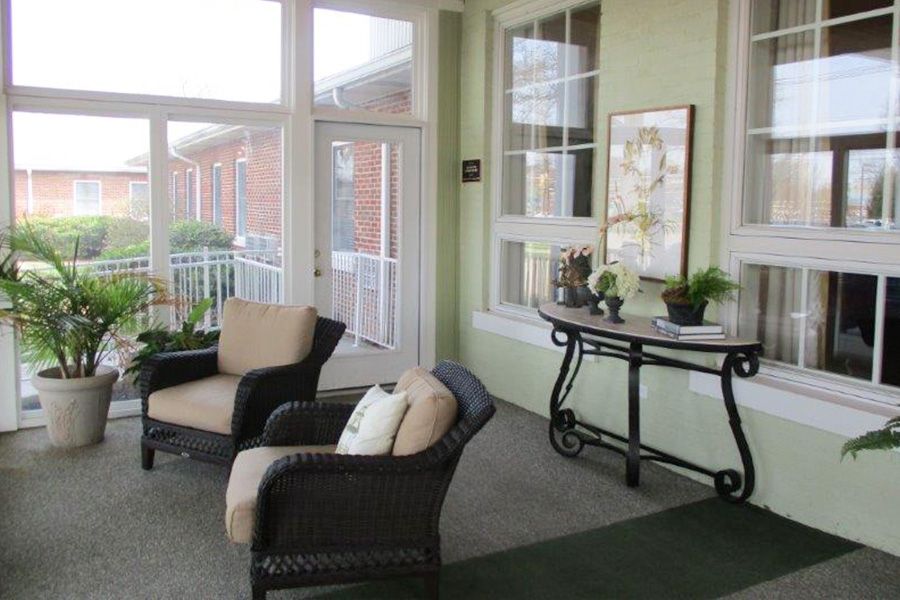 A cozy interior seating area with comfortable chairs and abundant natural light.