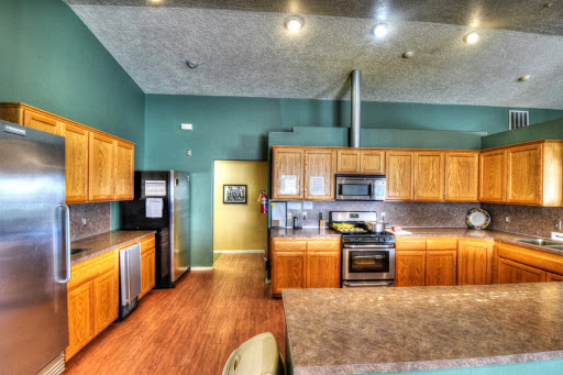 A modern kitchen featuring wooden cabinets, sleek appliances, and an open layout perfect for entertaining.