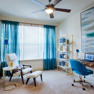 A modern home office with blue accents and stylish decor.