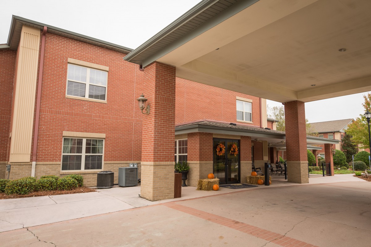 Entrance of a brick building with a covered walkway.
