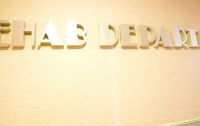 A partial view of text on a wall.