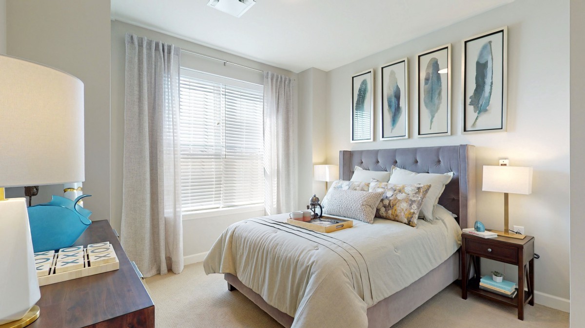 A modern and cozy bedroom with natural light and minimalist decor.