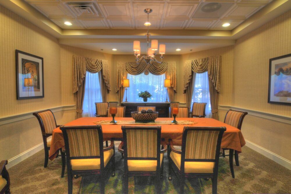 Elegant dining room with a chandelier and classic decor.