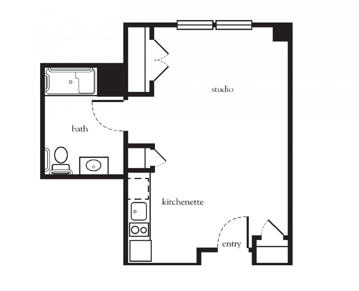 Floor plan of a studio apartment featuring a kitchenette, bathroom, and living/sleeping area.