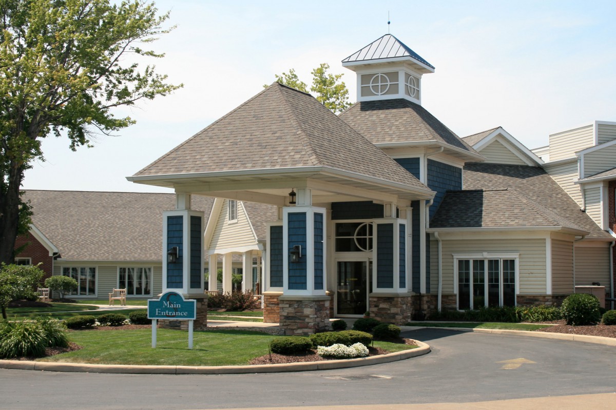 A well-designed building with a prominent entrance and landscaped surroundings.
