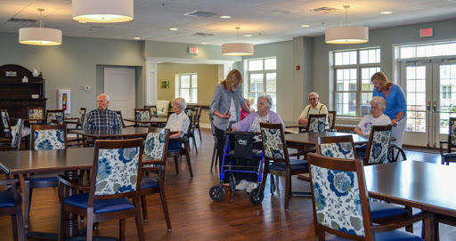 Residents enjoying social time in a welcoming community center for seniors.