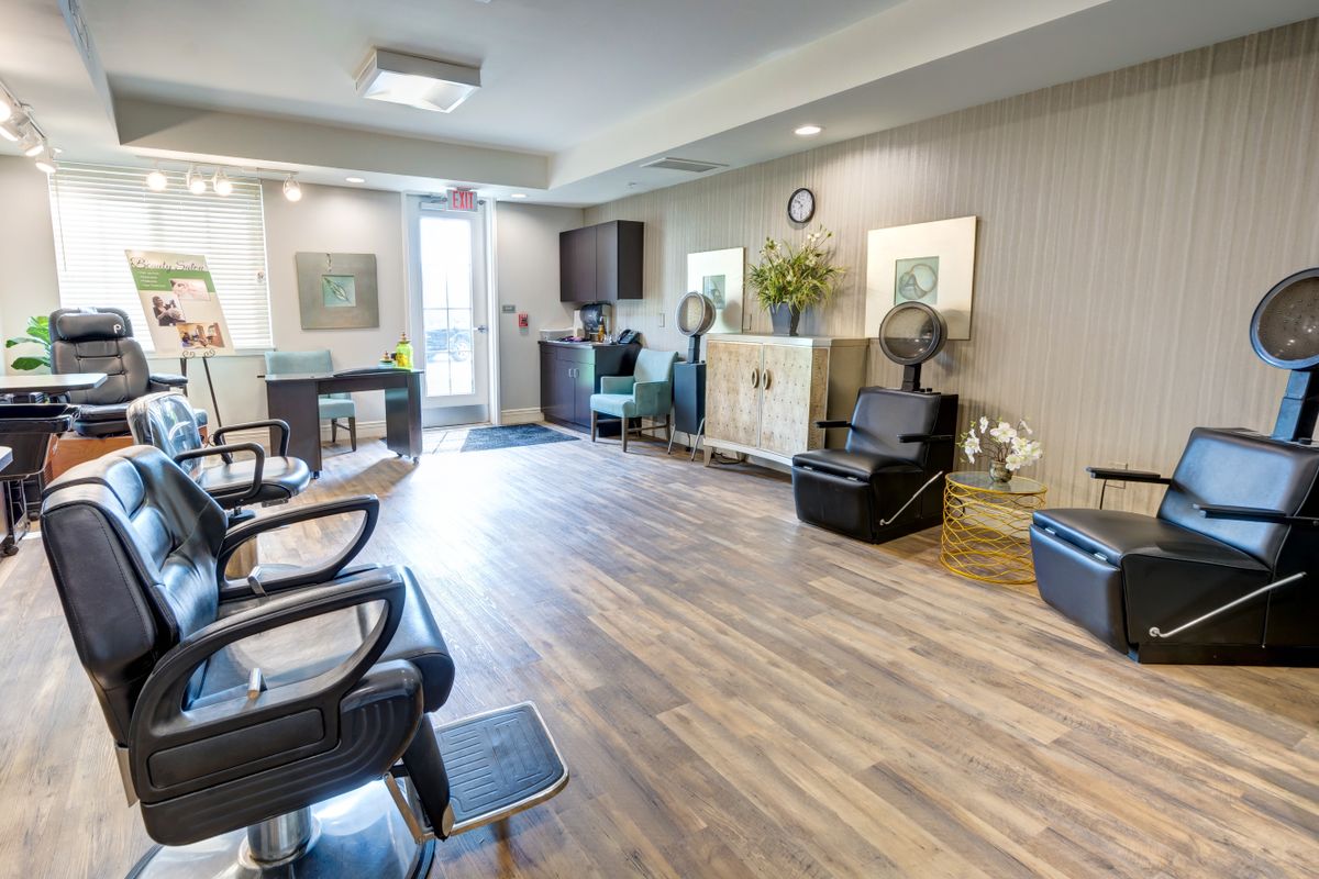 A modern salon with comfortable seating and elegant decor.