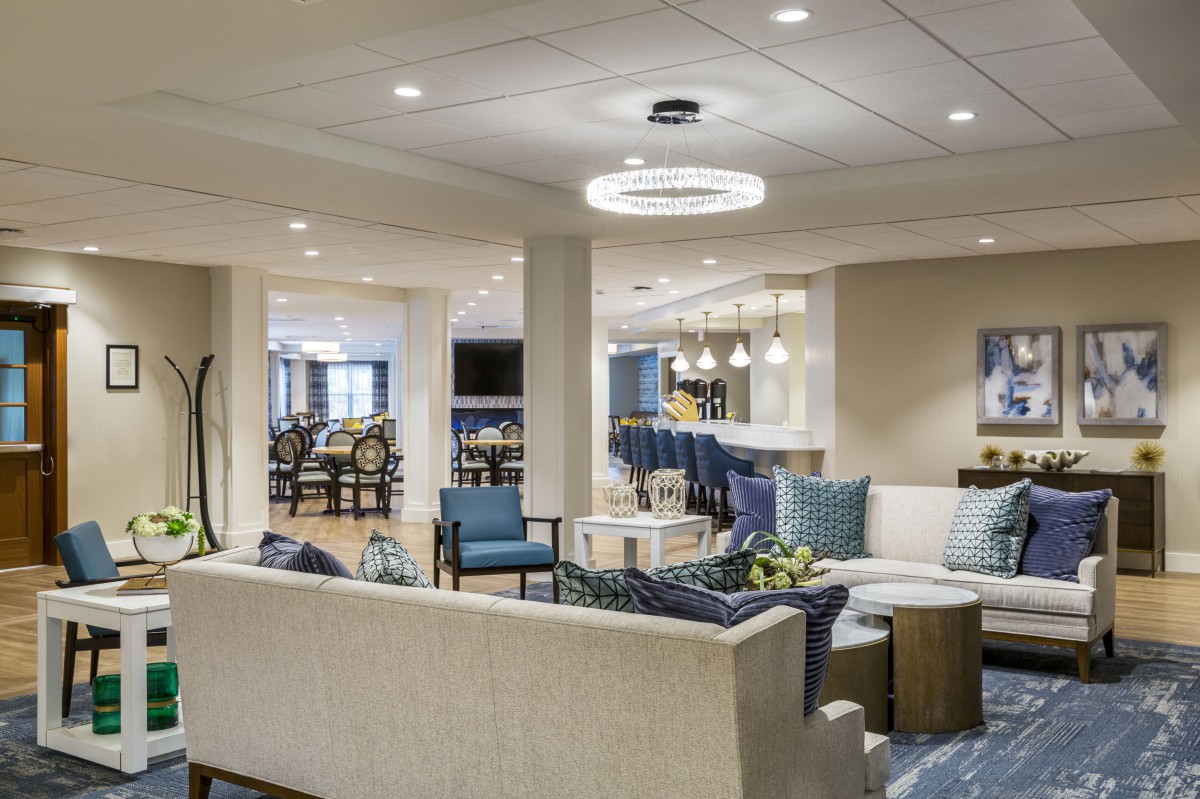 A modern lounge with comfortable seating and stylish lighting.