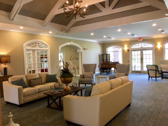 A cozy living room with comfortable seating and elegant decor.