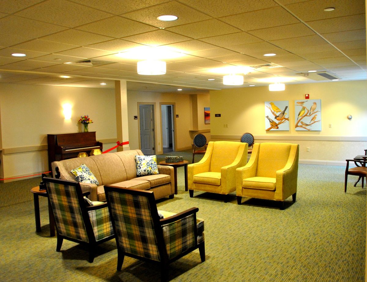A cozy lounge area with comfortable seating and warm lighting.