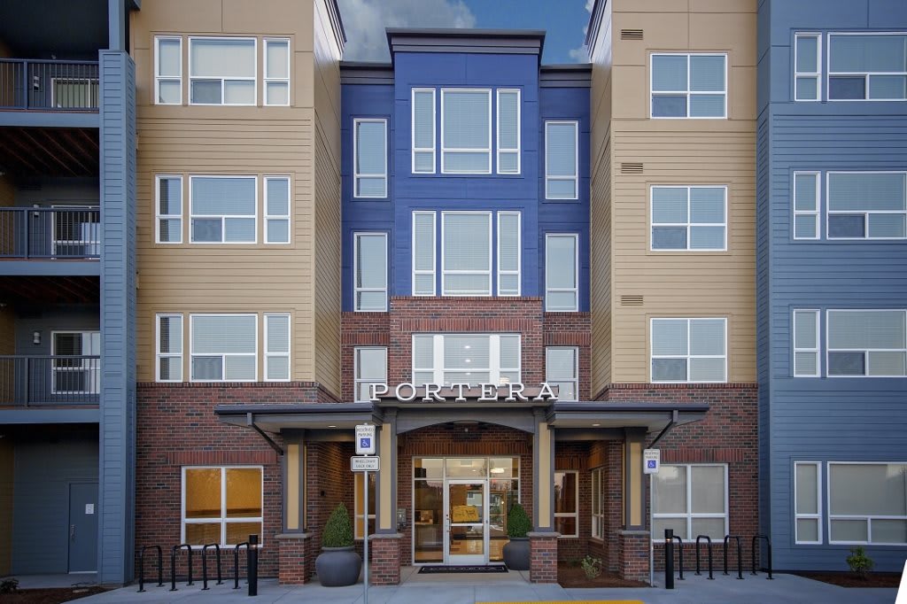 Front view of a modern apartment building entrance.