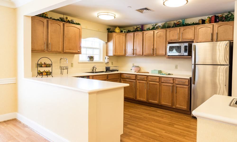 A spacious kitchen with wooden cabinets and a large island.