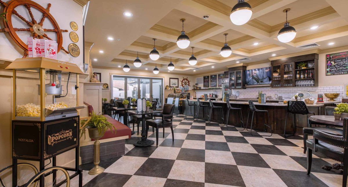 A cozy diner interior with checkered flooring and stylish lighting.