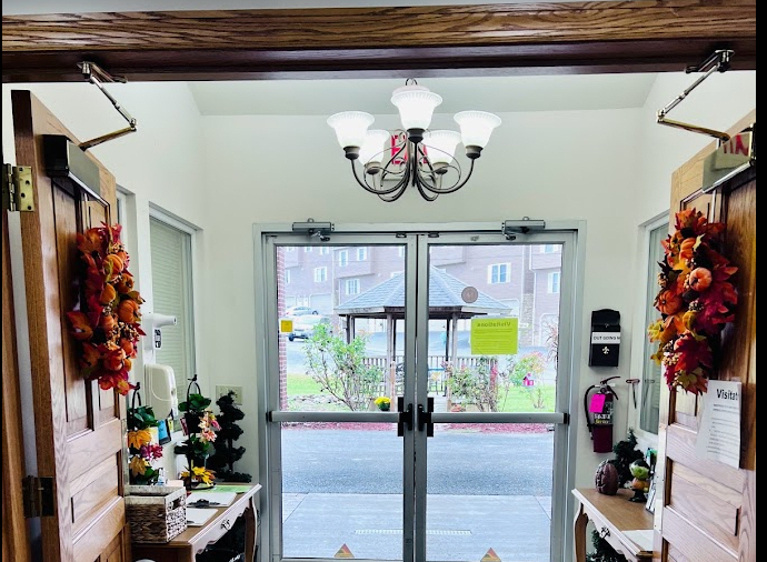 A cozy entrance with glass doors and decorative elements.