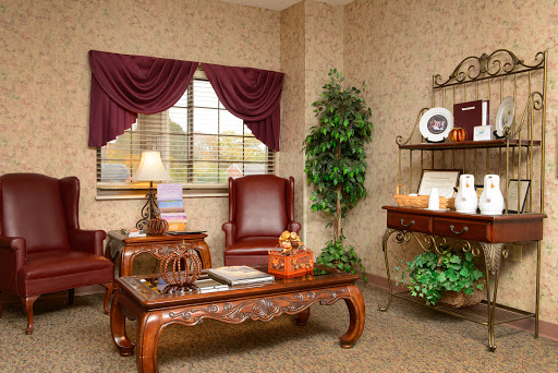 A cozy and stylish living room with elegant furniture and decorative elements.