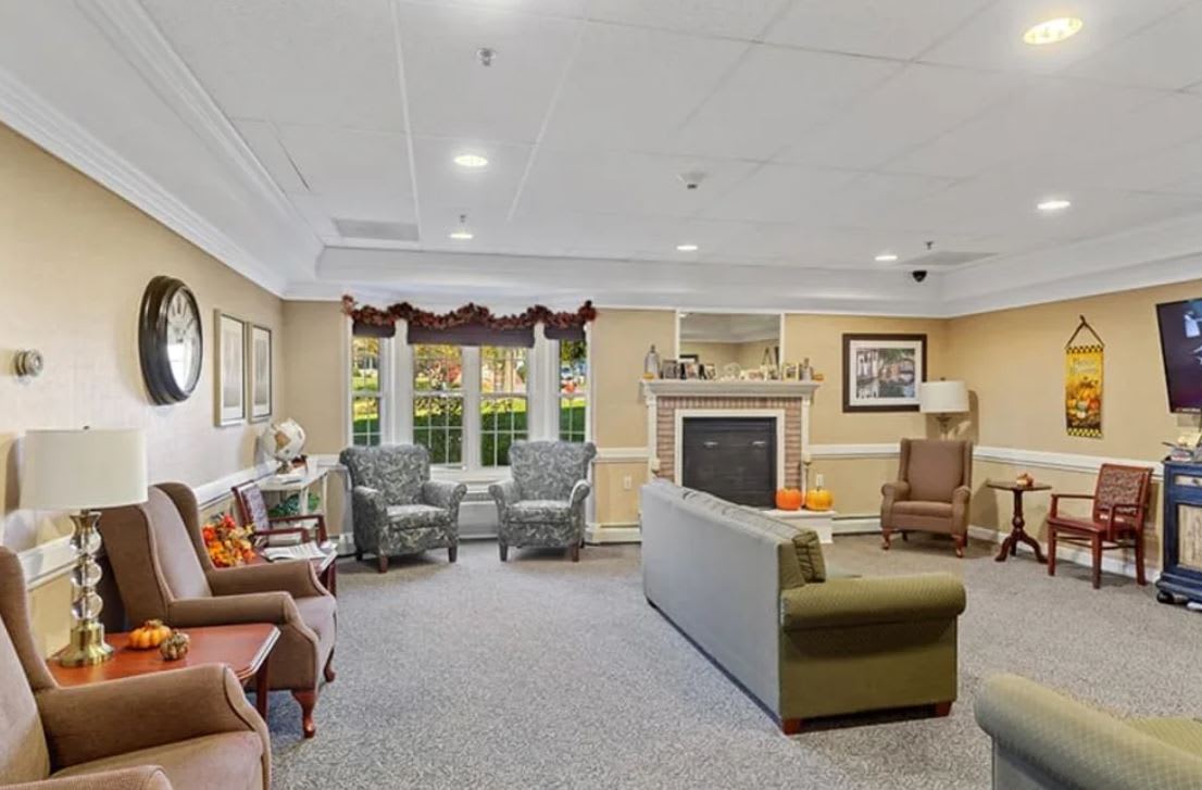A cozy living room with comfortable seating and a fireplace.