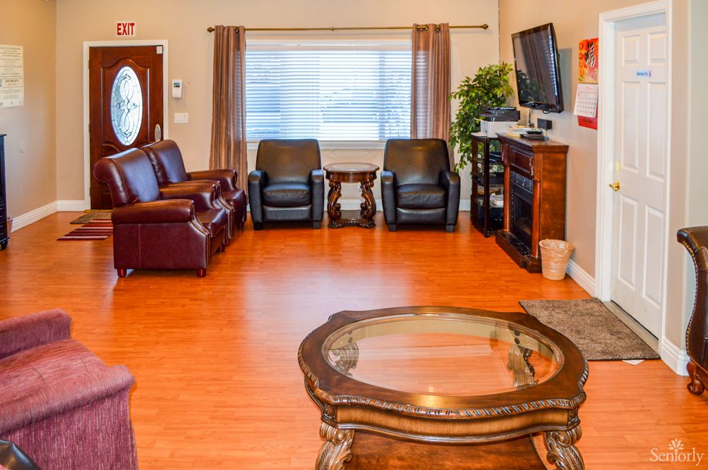A cozy living room with comfortable seating and a fireplace.