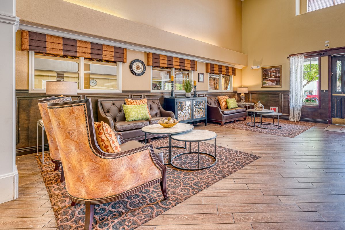 A cozy and modern living room with stylish furniture and decor.
