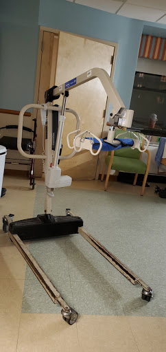 A patient lift system designed for assisting individuals with mobility challenges in a healthcare setting.