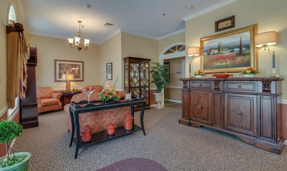 A traditionally styled living room featuring elegant furniture and decor.