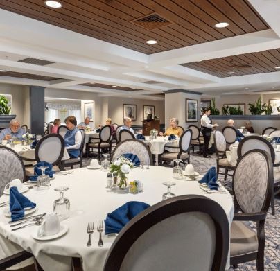 Elegant dining area with neatly arranged tables and chairs.