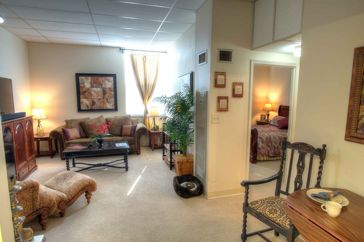 A cozy living room with warm lighting and elegant decor.