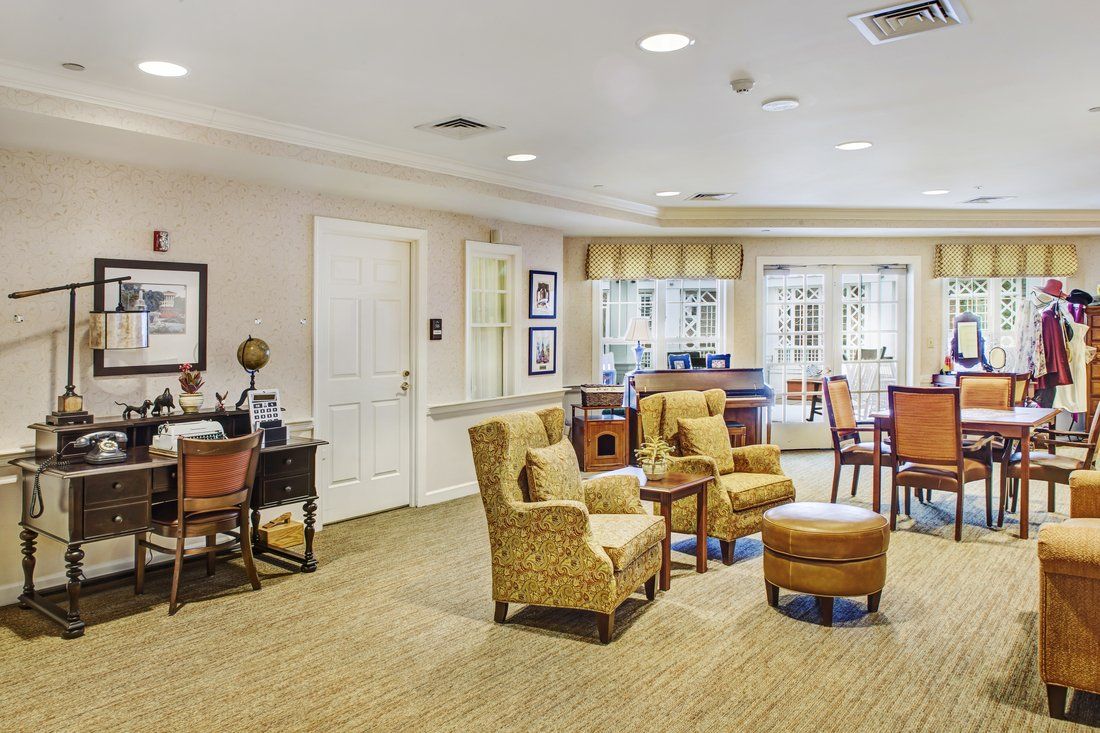 A well-furnished living room with comfortable seating and warm lighting.