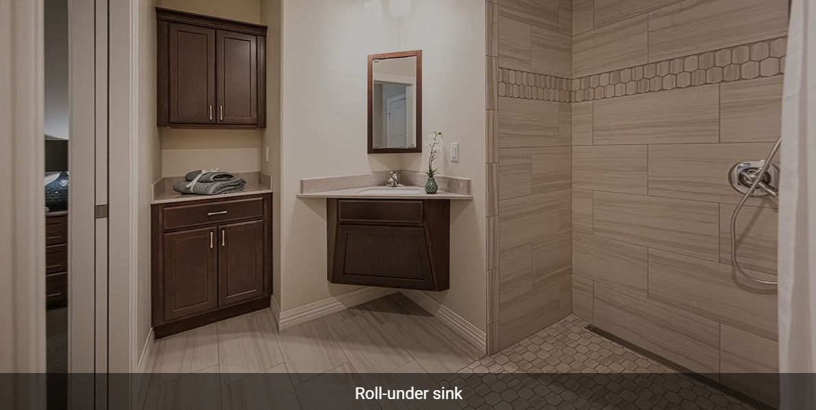 Accessible bathroom with a roll-under sink.