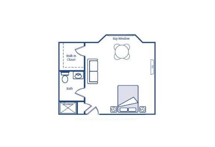 A floor plan of a studio apartment with designated areas for living room, bedroom, kitchen, and bathroom.