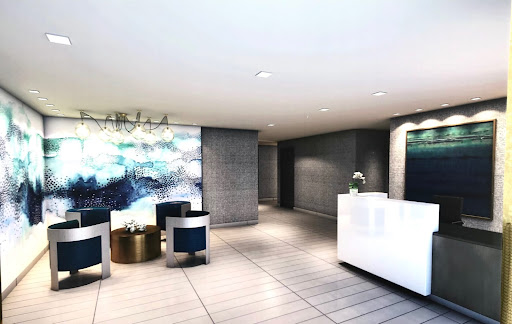 A stylish and modern hotel lobby featuring a sleek reception desk and contemporary seating arrangements.