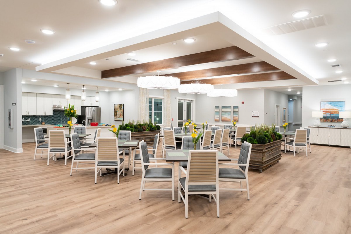 A modern dining area featuring stylish furniture and elegant lighting.