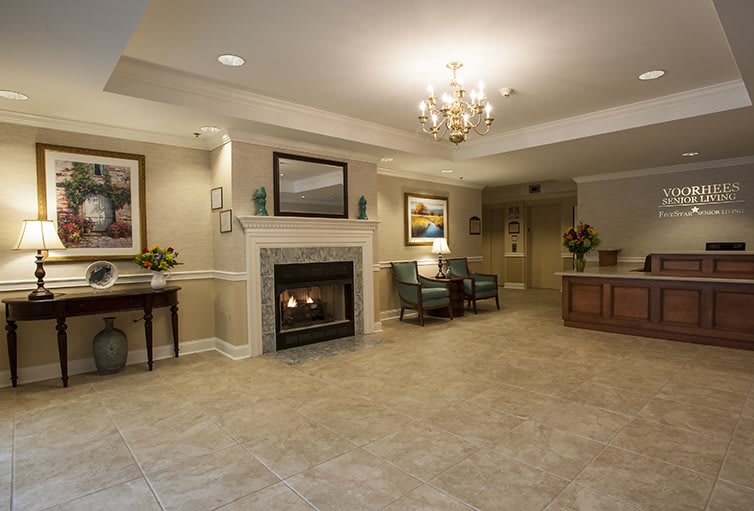 A cozy lobby with a fireplace and elegant decor.