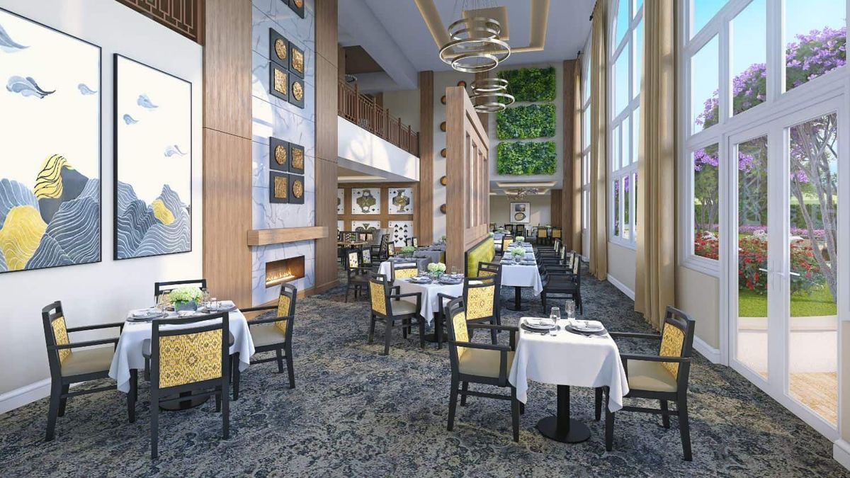 A modern and elegant restaurant interior with neatly arranged tables and large windows.