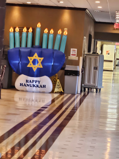 A festive inflatable Menorah celebrating Hanukkah.