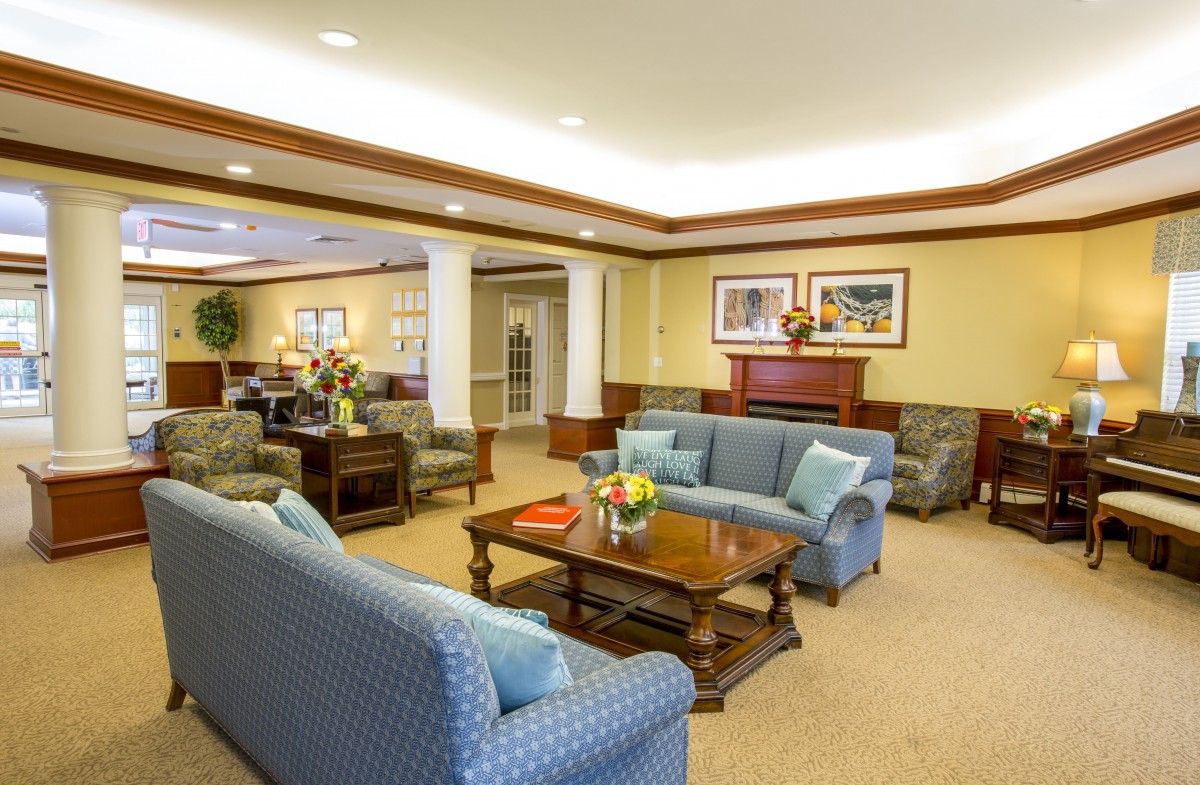 A cozy living room with sofas and a coffee table, showcasing elegant interior design.
