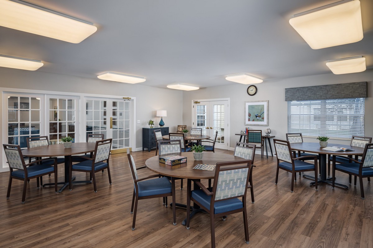 A bright and modern dining area with wooden floors and stylish furniture.