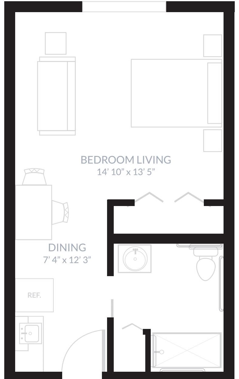 A compact apartment floor plan showing a combined bedroom and living area with an adjoining dining space.