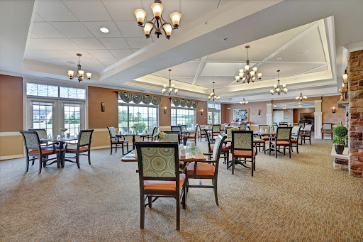A spacious and elegantly designed indoor dining area with comfortable seating and ambient lighting.
