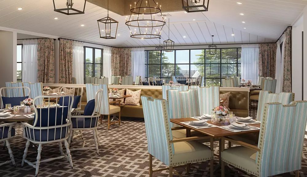 A modern restaurant dining area featuring elegant seating and stylish lighting.