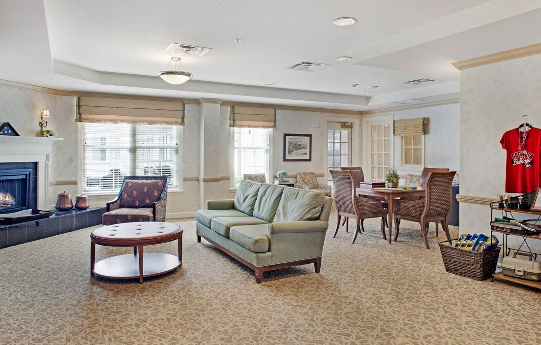 A cozy living room with comfortable seating and natural light.