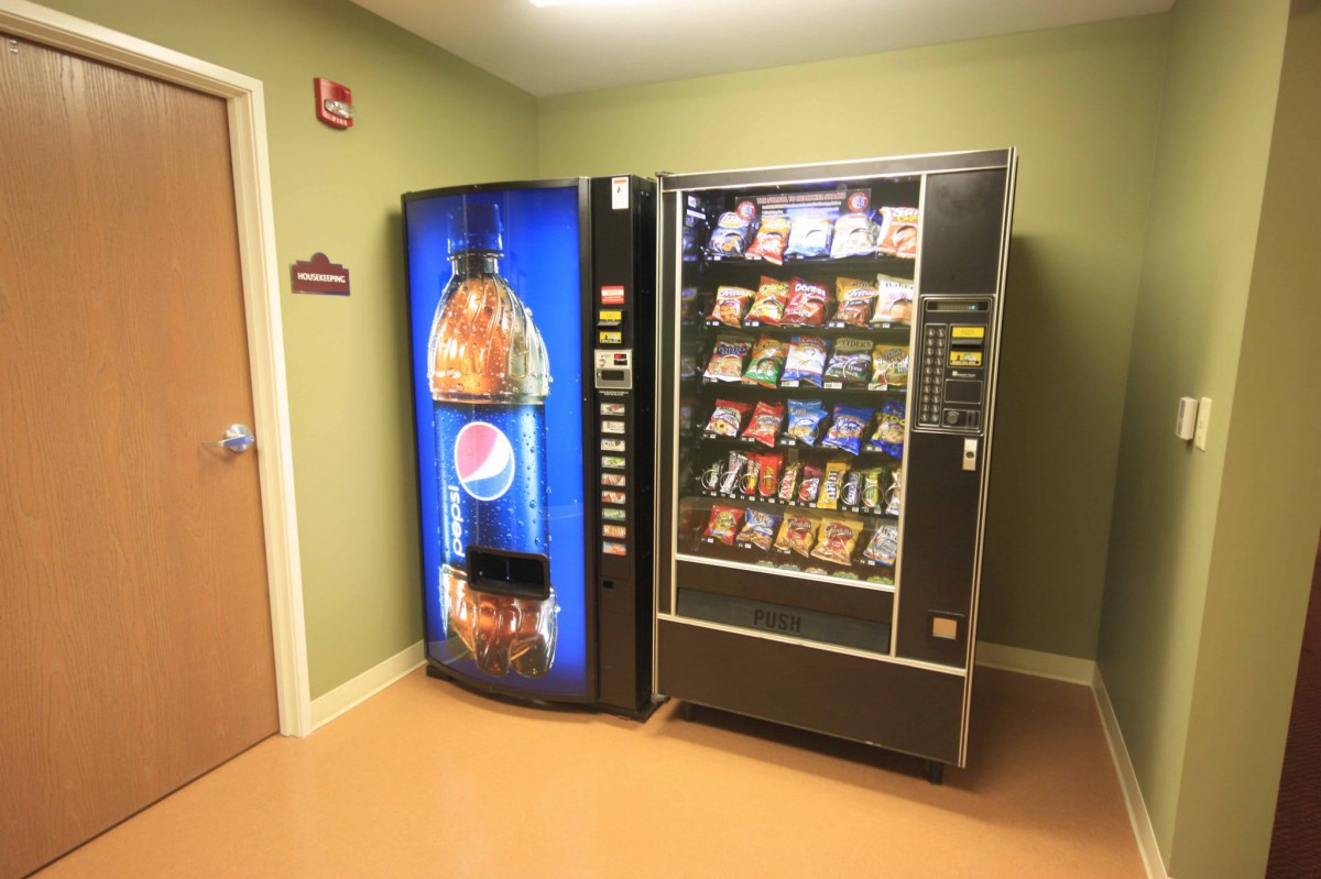 A snack and drink vending machine indoors, offering a variety of refreshments.
