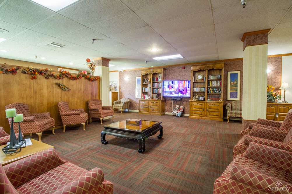 A cozy living room with comfortable seating and a TV.
