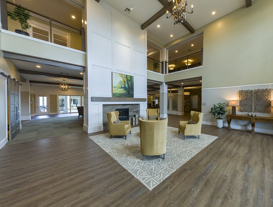 A spacious and modern lobby area with elegant furnishings and high ceilings.