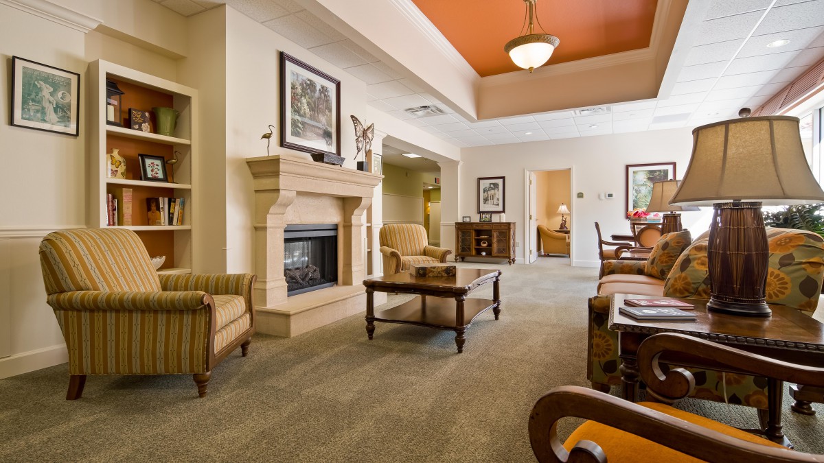 A cozy living room with a fireplace and comfortable seating.