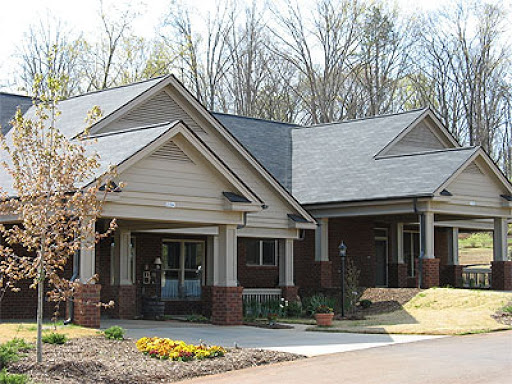A welcoming residential building surrounded by greenery.